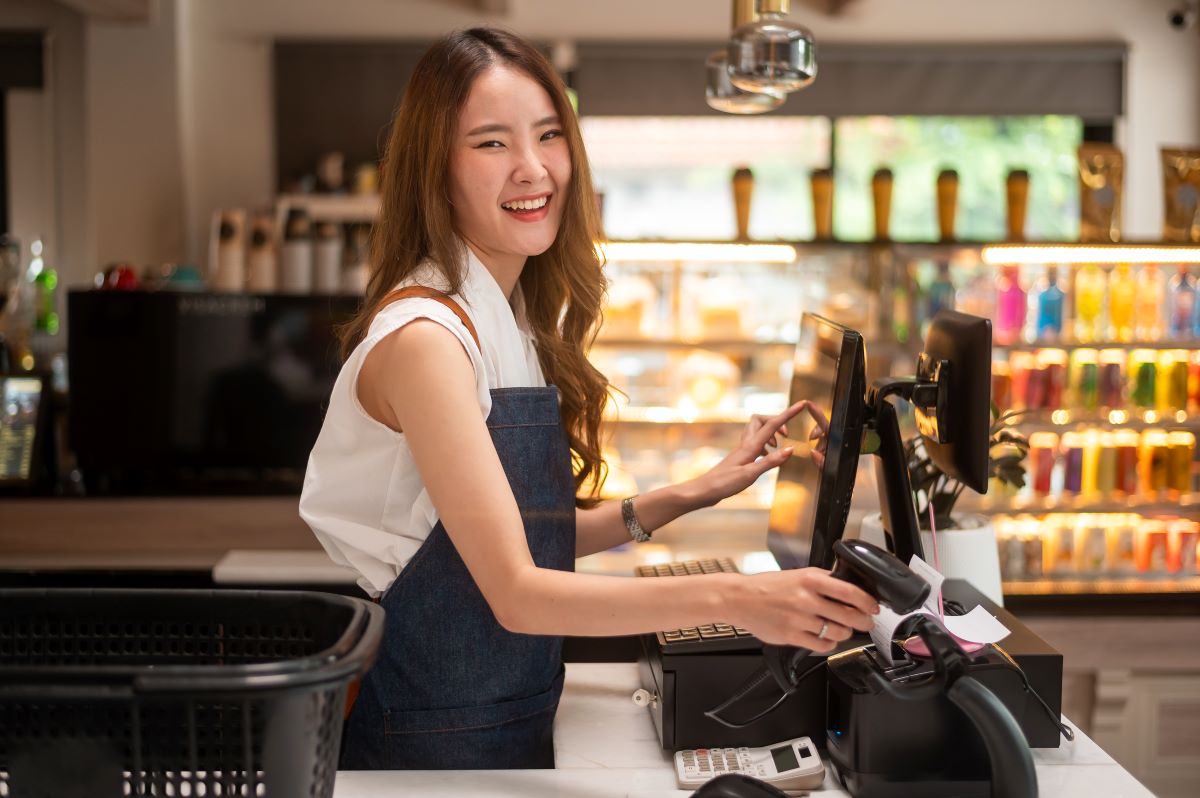 asian-young-cashier-woman-working-supermarket